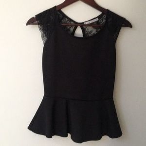Peplum top with Lacey shoulders and back.